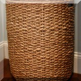 D85. Woven wicker hamper. Damage near bottom. 24”h x 20”w x 13”d - $12 